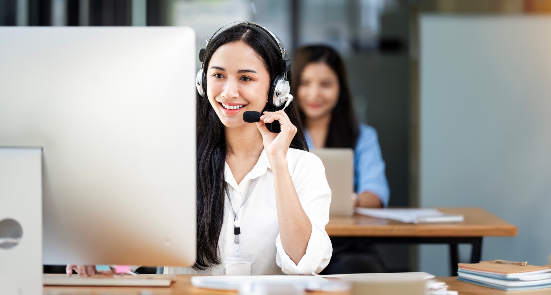 Smiling customer support operator at work.